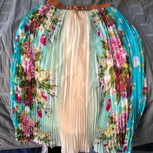 A long, floral skirt with a tie-up belt